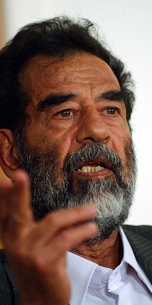 410px-Saddam_Hussein_at_trial,_July_2004-edit1