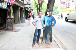 New York, NY, USA: Presenter Daniel Pink stands alongside a cardboard cut-out of a cop, used to deter bike thiefs out on the streets. (Cop posed by actor Andrew Deffley).?(Photo Credit: National Geographic Channels)