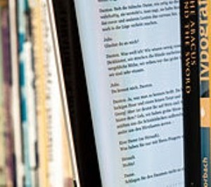 E-book-reader-between-print-books