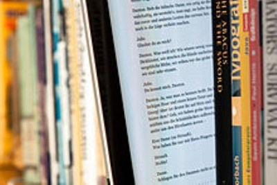 E-book-reader-between-print-books