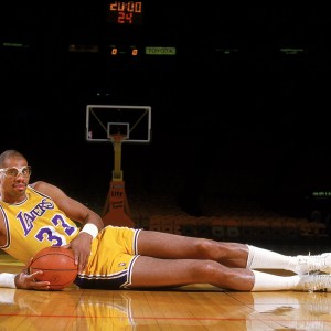 Undated: Kareem Abdul- Jabbar of the Los Angeles Lakers poses for the camera as he lays on the court.  Mandatory Credit: Rick Stewart  /Allsport