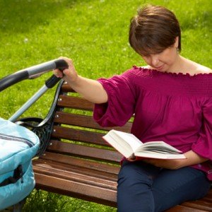 mom-reading-book-baby-stroller