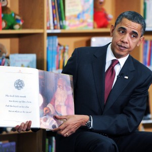 ARLINGTON, VA - DECEMBER 17:  U.S. President Barack Obama reads a book to about 90 second graders at Long Branch Elementary School December 17, 2010 in Arlington, Virginia. Obama is expected to sign the compromise $858 billion tax legislation later in the day.   (Photo by Olivier Douliery-Pool/Getty Images)