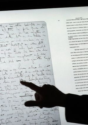 epa06054158 A man uses a touch screen to examine the manuscript 'The Trial' on a touch screen device and part of the exhibition 'Franz Kafka. The Whole Trial' in the Martin Gropius Bau, in Berlin, Germany, 28 June 2017. For the first time after it was written over 100 years ago the whole manuscript can be seen in Berlin. The idea for Kafka's famous work emerged from his conversation with his fiancee Felice Bauer about their engagement, something that the writer as a court session sensed.  EPA/FELIPE TRUEBA