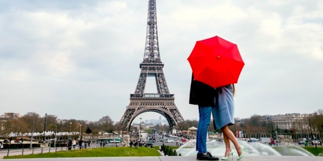 couple-kissing-behind-red-umbrella-paris-honeymoon-against-eiffel-tower-dreamstime-800-2x1