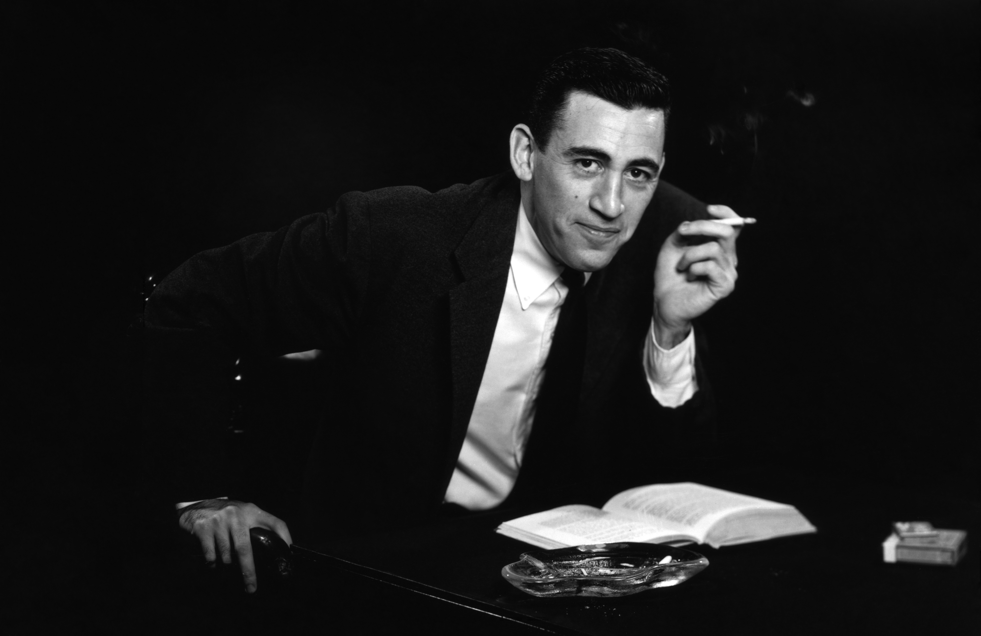 NEW YORK - NOVEMBER 20, 1952: *** EXCLUSIVE - CALL FOR IMAGE *** JD Salinger poses for a portrait as he reads from his classic American novel "The Catcher in the Rye" on November 20, 1952 in the Brooklyn borough of New York City. Salinger died on January 27, 2010. (Photo by Antony Di Gesu/San Diego Historical Society/Hulton Archive Collection/Getty Images)